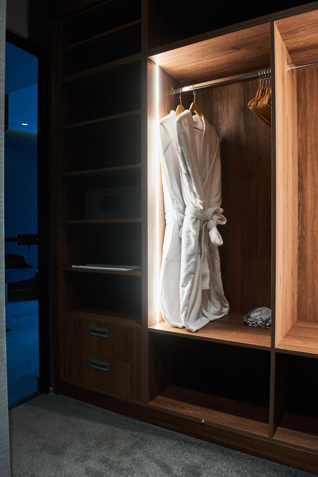 Hotel Pupin Novi Sad Bagian luar foto A bathrobe hanging in a closet